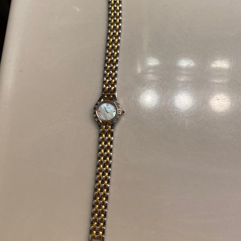 Pulsar Women’s watch. Two tone with mother of pearl face and diamonds.